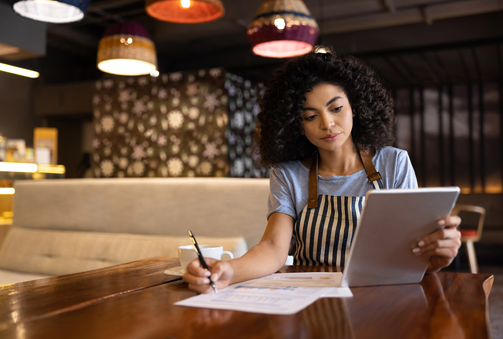 female entrepreneur works in her cafe